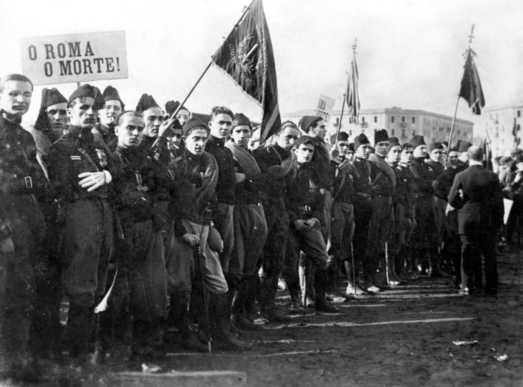 Protesters carrying signs “Rome or death”